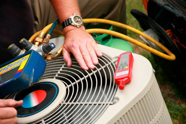 HVAC technician servicing unit